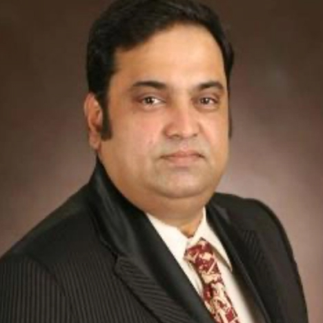 Dr. K. T. Mahi